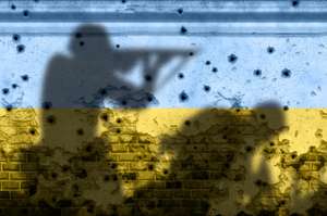 A silouette of soldiers fighting on a wall painted in the colors of the Ukrainian flag