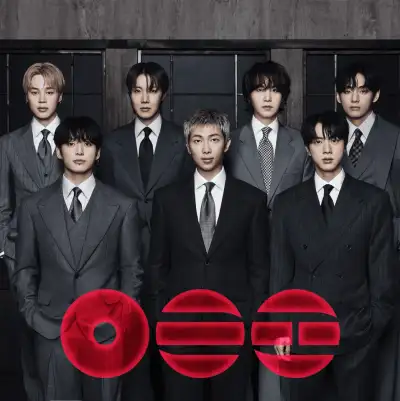 Album cover for the Arirang by BTS. Mostly white with 3 red circular images at the bottom.